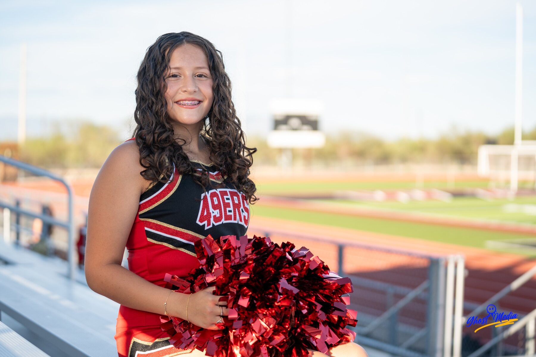 Cheerleader portrait in stadium seating