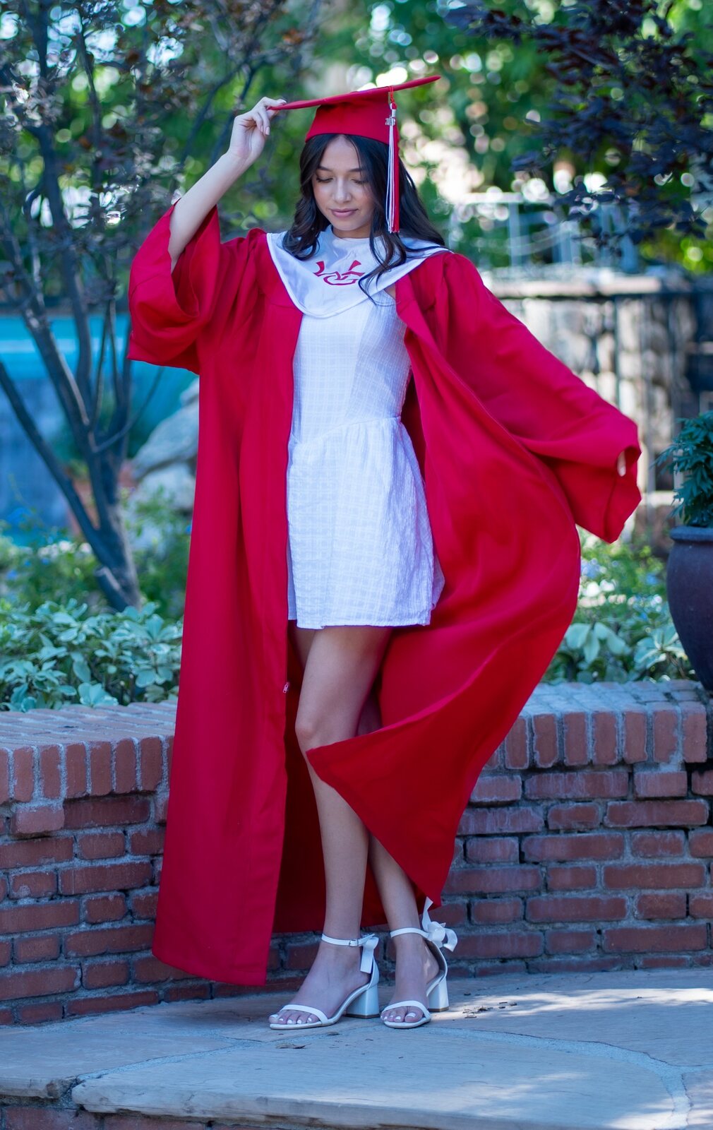 Graduate in a red cap and gown